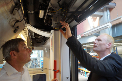 VAG system technician Robert Meier and igus® expert Werner Pecher test a door system with chainflex® cables and e-chain®.